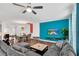Spacious living space with ample natural light, comfortable seating, and an adjacent dining area at 1615 Sanibel Dr, Davenport, FL 33896