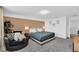 Spacious main bedroom with a plush bed, accent wall, and seating area, offering a serene and relaxing retreat at 1615 Sanibel Dr, Davenport, FL 33896
