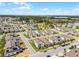 Aerial view of a residential neighborhood, featuring tree-lined streets and scenic ponds at 16484 Angel Fish Rd, Winter Garden, FL 34787