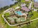 Community aerial featuring a pool, mini golf, volleyball court, and other recreational amenities at 16484 Angel Fish Rd, Winter Garden, FL 34787