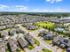 Community aerial featuring a large park, amenity center, and well-maintained landscaping at 16484 Angel Fish Rd, Winter Garden, FL 34787