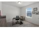 Neutral bedroom offers desk, chair and window views of the neighborhood at 16484 Angel Fish Rd, Winter Garden, FL 34787