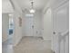 Bright foyer features tile flooring, arched doorways, and a stylish light fixture at 16484 Angel Fish Rd, Winter Garden, FL 34787