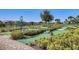 Fun mini golf course winding through lush greenery, providing a great outdoor activity for residents at 16484 Angel Fish Rd, Winter Garden, FL 34787