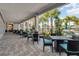 An outdoor dining area with tables and chairs, perfect for enjoying meals in a pleasant outdoor setting at 16484 Angel Fish Rd, Winter Garden, FL 34787