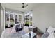 Cozy screened patio with seating, a ceiling fan, and views of the backyard at 16484 Angel Fish Rd, Winter Garden, FL 34787
