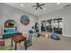 A fun playroom with themed decor, comfortable seating and toys to keep the little ones entertained at 16484 Angel Fish Rd, Winter Garden, FL 34787