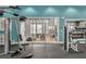 View of well-equipped fitness center and a playroom with comfortable seating and -friendly design at 16484 Angel Fish Rd, Winter Garden, FL 34787