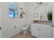 Cozy powder room features granite counters, tile floors, and a modern vanity at 16484 Angel Fish Rd, Winter Garden, FL 34787