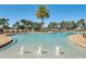 Sparkling resort-style pool with fountains and plenty of lounge chairs for relaxation and enjoyment at 16484 Angel Fish Rd, Winter Garden, FL 34787