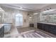 Luxurious bathroom featuring free standing tub and frameless shower at 1676 Song Sparrow Ct, Sanford, FL 32773