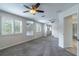 Large second floor bedroom with multiple windows and a mirror at 1676 Song Sparrow Ct, Sanford, FL 32773