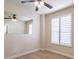 Bedroom with neutral walls, wood floors, large window and mirror at 1676 Song Sparrow Ct, Sanford, FL 32773
