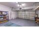 Spacious two-car garage featuring storage shelving, and an automatic door opener at 1676 Song Sparrow Ct, Sanford, FL 32773