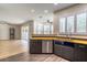 Kitchen with stainless steel appliances, sink and view of the living room at 1676 Song Sparrow Ct, Sanford, FL 32773