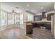 Modern kitchen with dark cabinets, wooden countertops, stainless steel appliances and lots of natural light at 1676 Song Sparrow Ct, Sanford, FL 32773