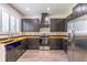 Modern kitchen with dark cabinets, wooden countertops, stainless steel appliances and lots of natural light at 1676 Song Sparrow Ct, Sanford, FL 32773