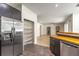 Modern kitchen featuring stainless steel appliances, wood countertops, and convenient pantry storage at 1676 Song Sparrow Ct, Sanford, FL 32773