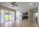 Open-concept living area flows into a modern kitchen with stainless steel appliances at 1676 Song Sparrow Ct, Sanford, FL 32773