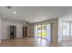 Spacious living room featuring sliding glass doors and ample natural light at 1676 Song Sparrow Ct, Sanford, FL 32773