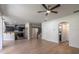 Open living area features modern kitchen and staircase access at 1676 Song Sparrow Ct, Sanford, FL 32773