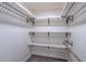 Walk-in closet with shelving units and a clothing rod at 1676 Song Sparrow Ct, Sanford, FL 32773