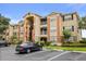 Attractive condo complex featuring a mix of stucco and siding, with well-maintained landscaping at 1979 Summer Club Dr # 115, Oviedo, FL 32765