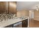 Well-equipped kitchen with granite countertops, stainless steel appliances, and ample cabinet space at 1979 Summer Club Dr # 115, Oviedo, FL 32765