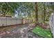 View of fenced-in backyard featuring lush trees and greenery at 2039 Beachberry Ln, Oviedo, FL 32765