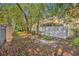 View of fenced-in backyard featuring lush trees and greenery at 2039 Beachberry Ln, Oviedo, FL 32765