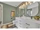 Beautiful bathroom featuring a double vanity, sleek fixtures, and plenty of storage at 2039 Beachberry Ln, Oviedo, FL 32765
