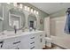 Bathroom featuring double sinks, sleek fixtures, and a separate shower and tub at 2039 Beachberry Ln, Oviedo, FL 32765