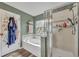Bright bathroom boasting a soaking tub and separate glass-enclosed shower at 2039 Beachberry Ln, Oviedo, FL 32765