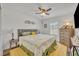 Comfortable bedroom with a ceiling fan and soft natural light at 2039 Beachberry Ln, Oviedo, FL 32765