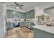 Charming kitchen with stainless steel appliances and plenty of cabinets, perfect for cooking enthusiasts at 2039 Beachberry Ln, Oviedo, FL 32765
