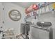 Well-organized laundry room equipped with modern washer and dryer units at 2039 Beachberry Ln, Oviedo, FL 32765