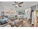 Open-concept living room flowing into the kitchen, creating a welcoming and airy atmosphere at 2039 Beachberry Ln, Oviedo, FL 32765