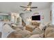 Spacious living area with a large sectional sofa, television, and stairs leading to the upper level at 2039 Beachberry Ln, Oviedo, FL 32765