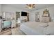The primary bedroom offers space for a workspace, a TV, and direct access to an ensuite bath and walk-in closet at 2039 Beachberry Ln, Oviedo, FL 32765