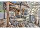 Outdoor patio includes a table and chairs and an umbrella for shade at 2039 Beachberry Ln, Oviedo, FL 32765