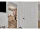 Spacious walk-in closet with custom shelving and drawers for optimal organization at 2039 Beachberry Ln, Oviedo, FL 32765