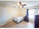 Cozy bedroom with tile floors, a ceiling fan, and a window providing natural light at 212 Ashford Dr, Davenport, FL 33837