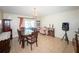 Inviting dining room area with large windows and a view of the backyard at 212 Ashford Dr, Davenport, FL 33837