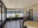 Relaxing screened-in lanai with comfortable seating and views of the backyard at 212 Ashford Dr, Davenport, FL 33837