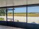 Enjoy the view from this outdoor lanai with a screened in area and a large grass backyard at 212 Ashford Dr, Davenport, FL 33837