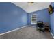 Bedroom featuring a window and carpeted flooring with blue colored walls at 2330 Little Gem Loop, Sanford, FL 32773