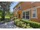 Charming home exterior with lush green landscaping and a welcoming walkway at 2330 Little Gem Loop, Sanford, FL 32773