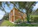 Charming two-story home with a well-maintained lawn and mature trees providing ample shade at 2330 Little Gem Loop, Sanford, FL 32773