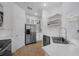 A bright kitchen featuring stainless steel appliances, ample cabinetry, and tiled floors at 2330 Little Gem Loop, Sanford, FL 32773