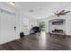 Spacious living room with laminate floors and a sliding glass door to the yard at 2330 Little Gem Loop, Sanford, FL 32773